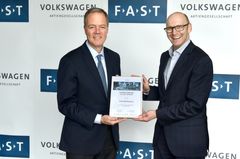 Cree CEO, Gregg Lowe stands with Mr. Baecker, Head of Volkswagen Purchasing Connectivity during Volkswagen Group's FAST partner selection ceremony held internally at their Wolfsburg, Germany headquarters on May 10.