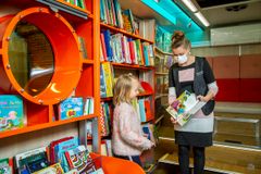 During the coronavirus emergency, the mobile libraries will run their evening routes as normal. The mobile libraries can be entered by two customers or one family at a time. Photo: Maarit Hohteri / City of Helsinki