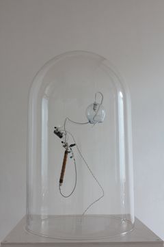 Soichiro Mihara: Bell, 2013. Installation. Geiger-Muller tube, glass, motor, microchip.