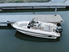 The wide-hulled boat is easy to board from the bow, sides and wide swimming platforms at the stern.