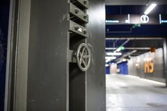 Reinforced concrete dual-purpose underground parking garage and mass shelter.