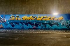 Divercity-teksti graffititeoksessa raitiolinjan 13 tunnelissa Vallilanlaaksossa.