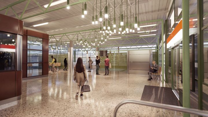 Havainnekuvasssa ihmisiä Herttoniemen metroaseman uudistetussa lippuhallissa.
