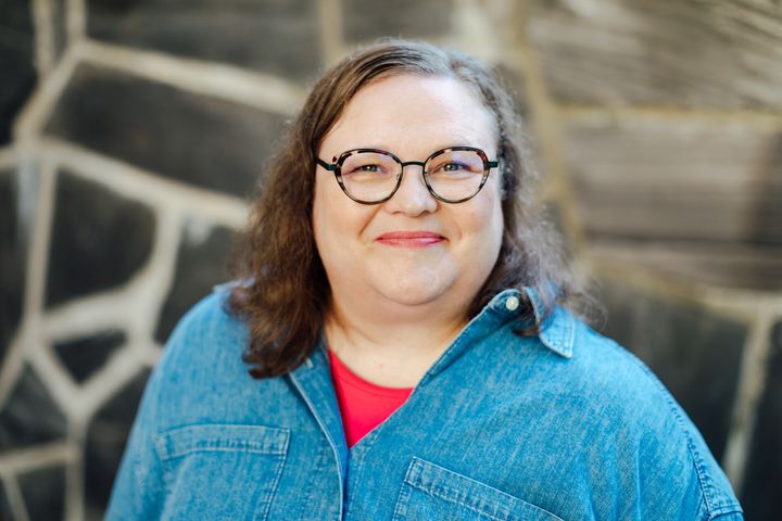 Woman looking at the camera smiling.