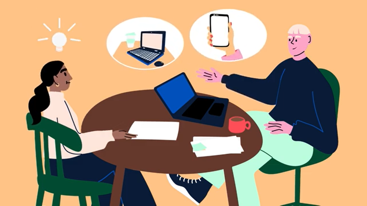 Drawing of two adults sitting at a table discussing computers and mobile phones.