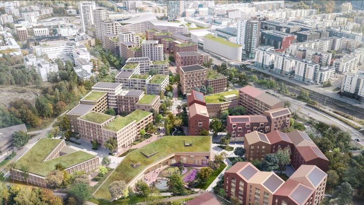 Havainnekuvassa näkyy kerrostaloja, katuja ja vihreää kaupunkiympäristöä kaupunkikeskustassa.