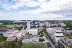 Havainnekuva, jossa näkyy etualalla matalampia vaaleita rakennuksia ja taustalla korkeampia.