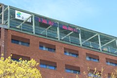 A light-up billboard on the roof of the Helsinki service location tells the Finland’s population number.