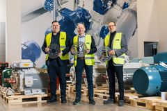 Cornerstone Award Winners: ABB's Tero Känsäkangas, Ari Tammi and Jouni Ikäheimo with SynRM motor's rotor plates.