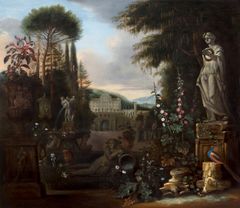 A peacock, sculptures, plants, and a building in the background.