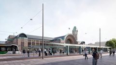 Havainnekuva ihmisistä katualueella ja raitiovaunupysäkeillä rautatieaseman edessä.