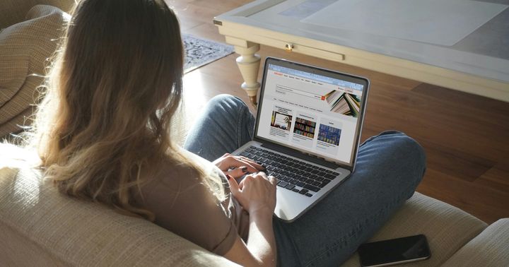 A woman uses the new Helmet web library on a laptop.