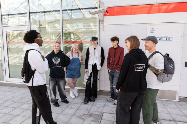 Youth workers talking to young people in the city of Helsinki.