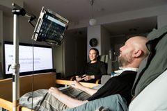 Harri Pennanen, a postdoctoral researcher at the University of Oulu's Centre for Wireless Communications (CWC) having a meeting with his colleague and friend research director Tuomo Hänninen (in the background)