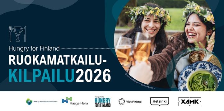 Kaksi henkilöä pitelee juomalaseja ja hymyilee, yllään kukkaseppeleet. Teksti: "Hungry for Finland  Ruokamatkailukilpailu 2026". Mukana logot Haaga-Helia, maa- ja metsätalousministeriö, Visit Finland, Helsingin kaupunki, XAMK.