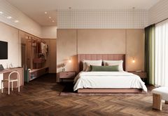 Tummahko kalanruotolattia makuuhuoneessa, jossa parisänky ja sänkyn takana vasemmalla kurkistus vaakehuoneeseen.