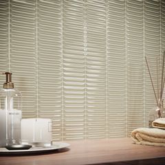 Arrow-malliston Olive-sävyinen sormilaatta seinässä.