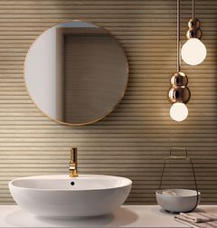 Ragnon Richmond-laatta seinässä. Edessä pyöreä käsienpesualla ja pyöreä peili.