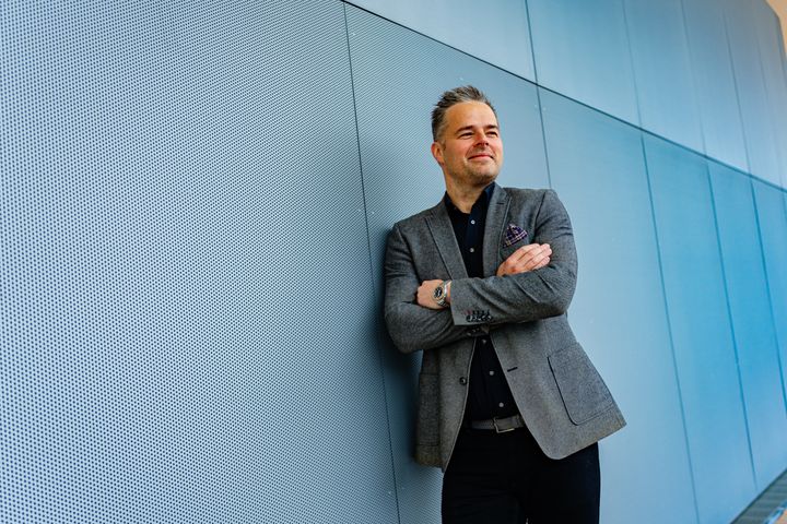 A man leaning into a wall