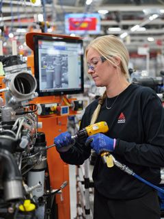 Mechanic assembling an AGCO Power engine in the engine assembly plant in Nokia, Finland.