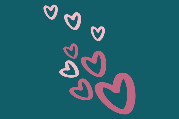 Vaaleanpunaiset sydämet leijuvat teal-vihreää taustaa vasten.