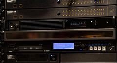 Occupying just one unit in the technical rack, the Spectera Base Station (in the middle) may look very compact, but it can handle up to 32 mic channels and 16 stereo IEMs. A classic narrowband system would have demanded much more space and would have had higher current consumption (Photo credit: Olivier Allard)