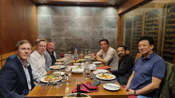 Sitting in the middle on both sides of the table are DHI CEO Ujjwal Deep Dahal and Avant Wood Oy Chairman of the Board Pekka Ritvanen.