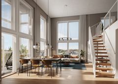 Kaunis ja valoisa T2H:n loft-asunnon olohuone, jossa katto korkealla, isot ikkunat, ruokailuryhmä ja portaikko.