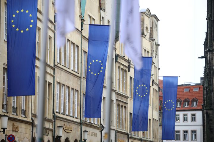 EU flags hang from the Historic Town Hall in Münster.